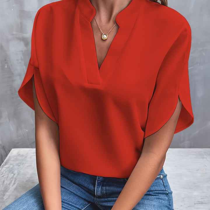 Red women’s luxe flared top with V-neck and draped short sleeves