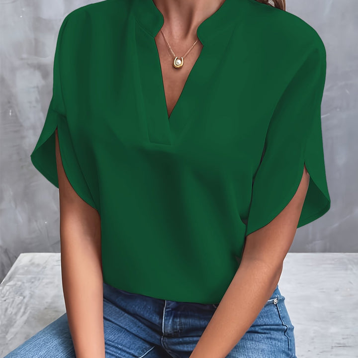 Green women’s luxe flared top with V-neck and draped short sleeves