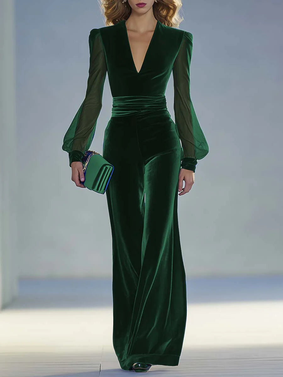 Green suede V-neck jumpsuit with long fitted sleeves and pleated waist seams