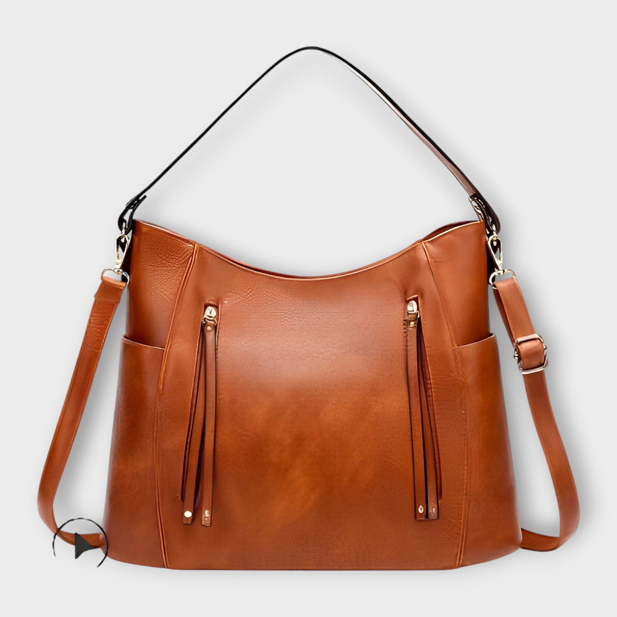 Tan leather hobo handbag with zip front, tassel details, and two shoulder straps.