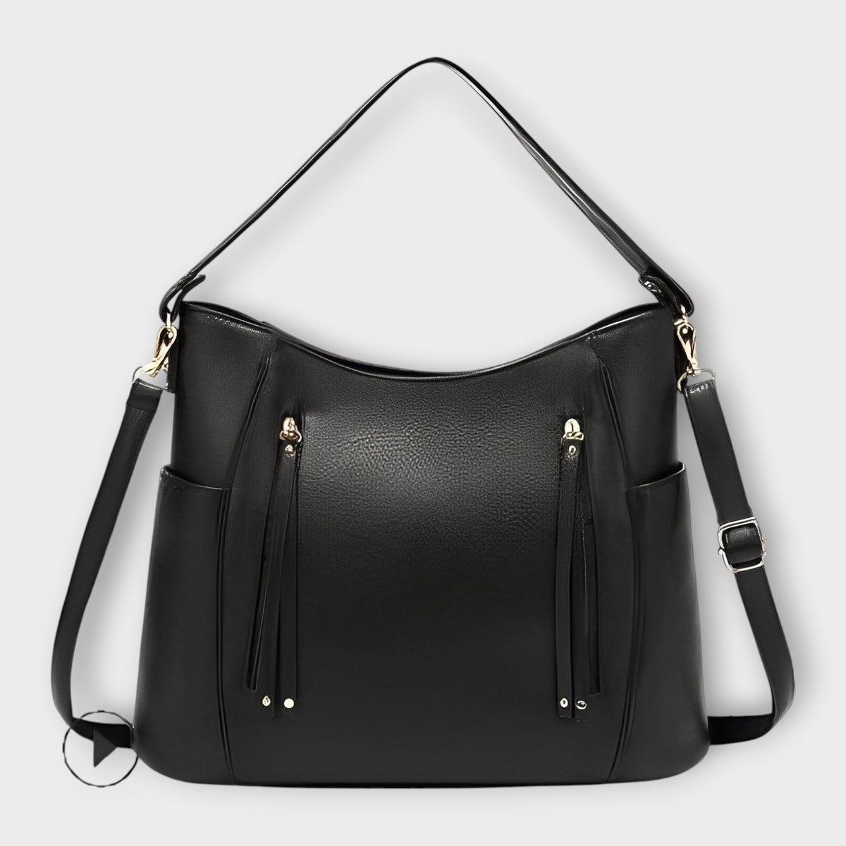 Black leather hobo handbag with zip front and tassel details, plus shoulder straps.