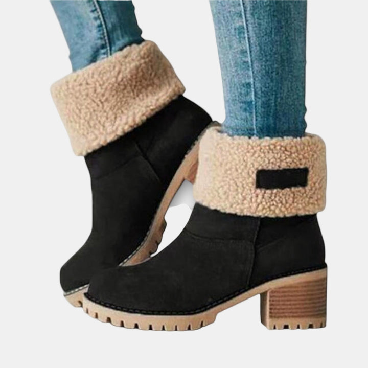 Black suede casual boots with tan shearling cuff, side buckle detail, block heel