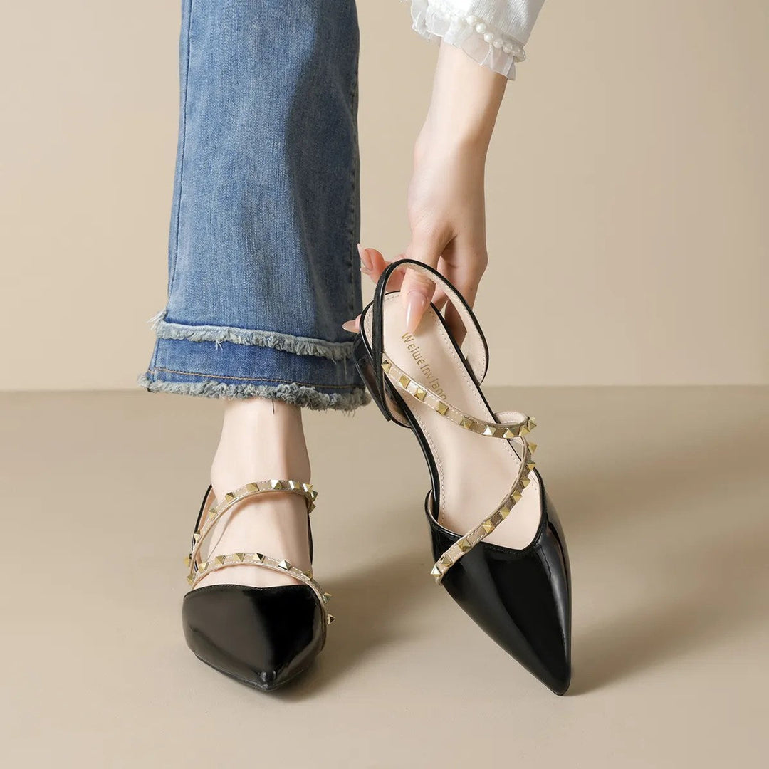 Black orthopedic heels with pointed toe and gold-tone stud strappy straps, block heel