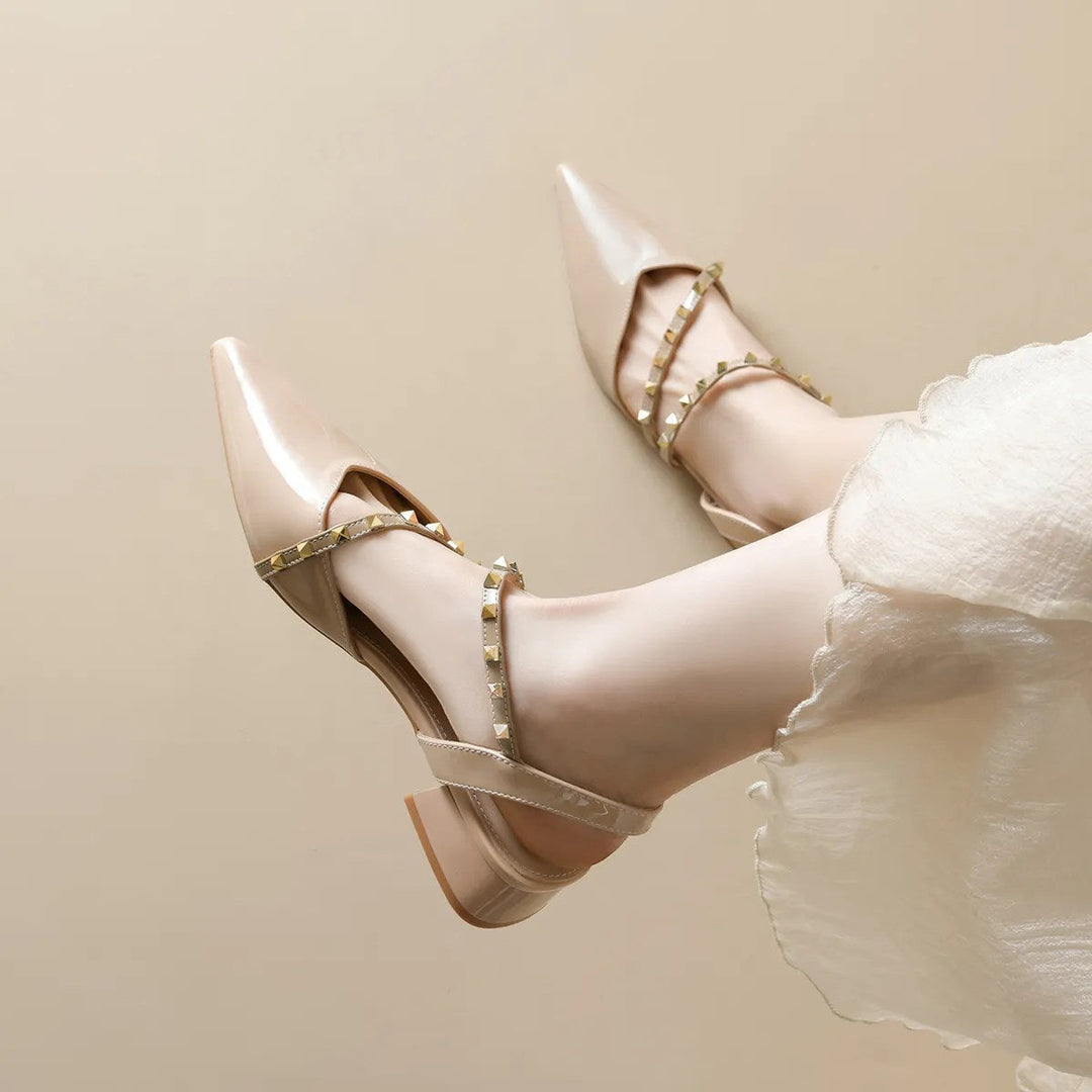 Beige orthopedic heels with slingback strap and gold-tone stud trim, block heel