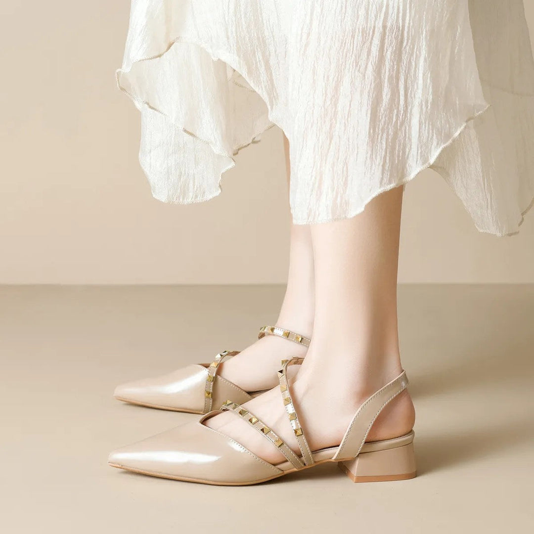 Beige strappy orthopedic heels with pointed toe and gold-tone stud trim on block heel