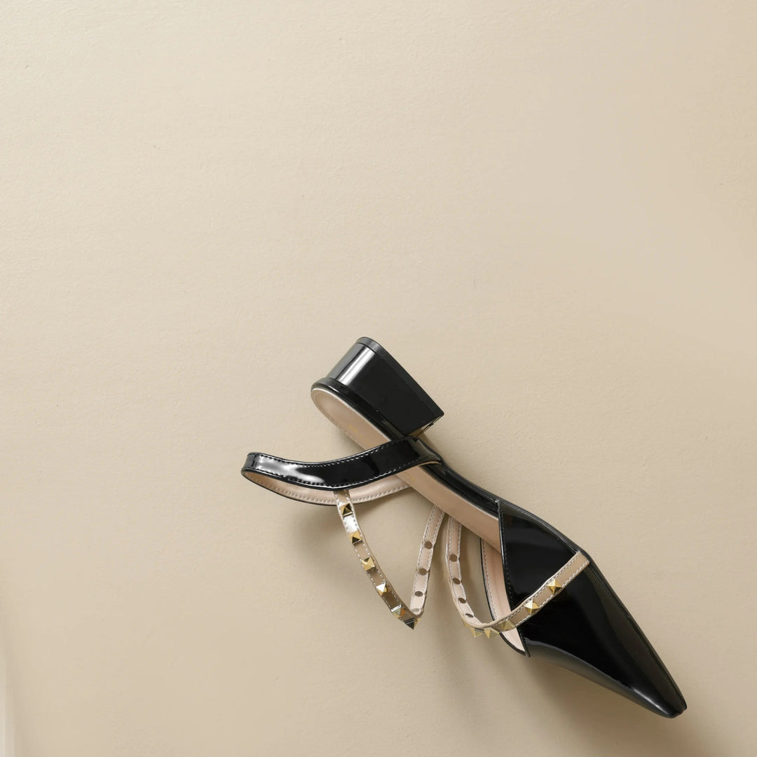 Orthopedic heeled slingback sandal with studded straps, black, side profile