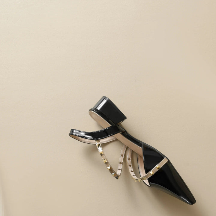 Orthopedic heeled slingback sandal with studded straps, black, side profile