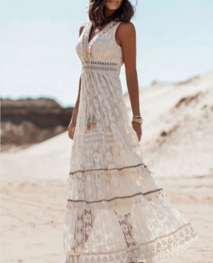 White boho sleeveless maxi dress with lace tiers and vertical embroidery pattern