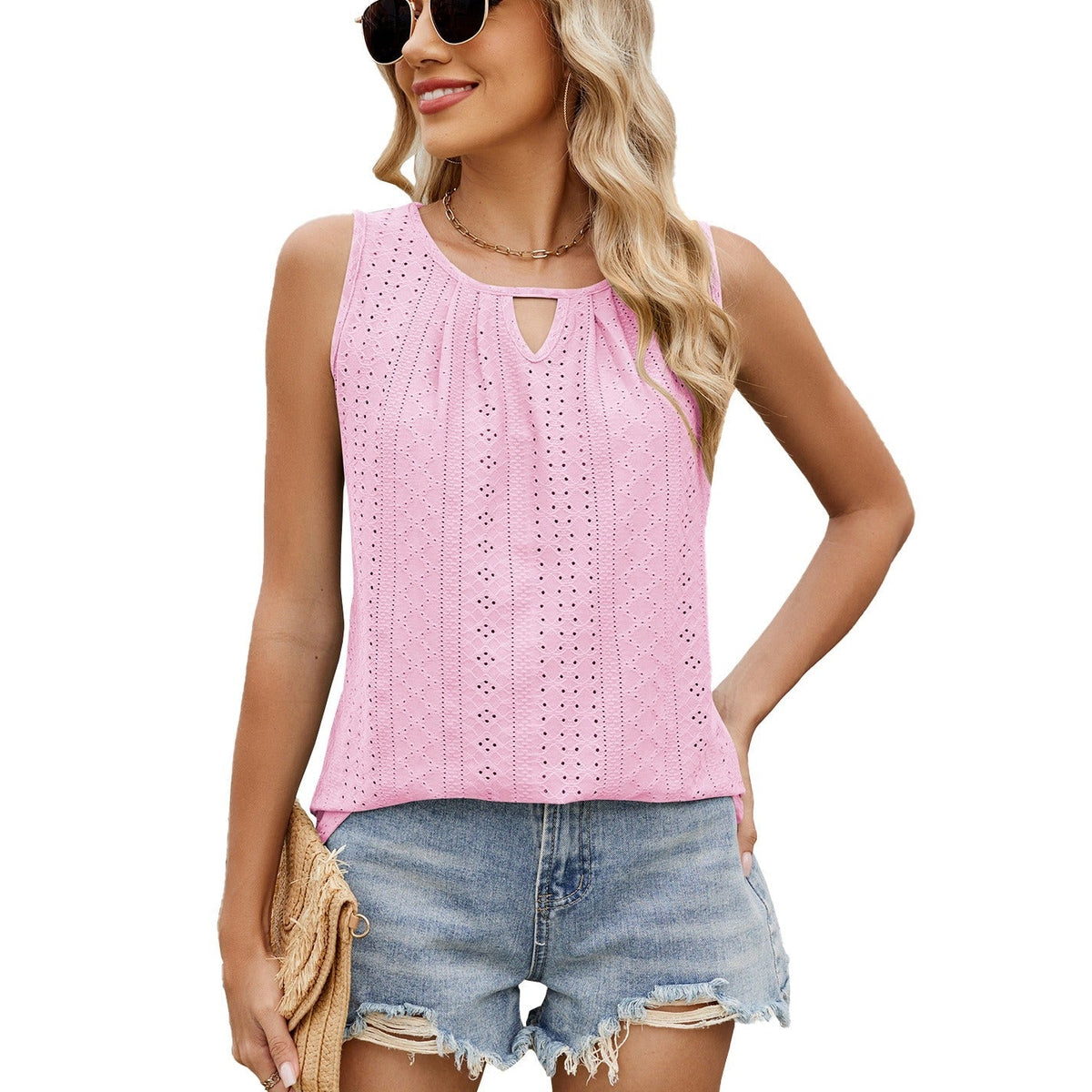 Light pink sleeveless loose-fit top with keyhole neckline and dotted eyelet pattern