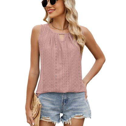 Pink sleeveless loose-fit top with keyhole neckline and dotted eyelet pattern