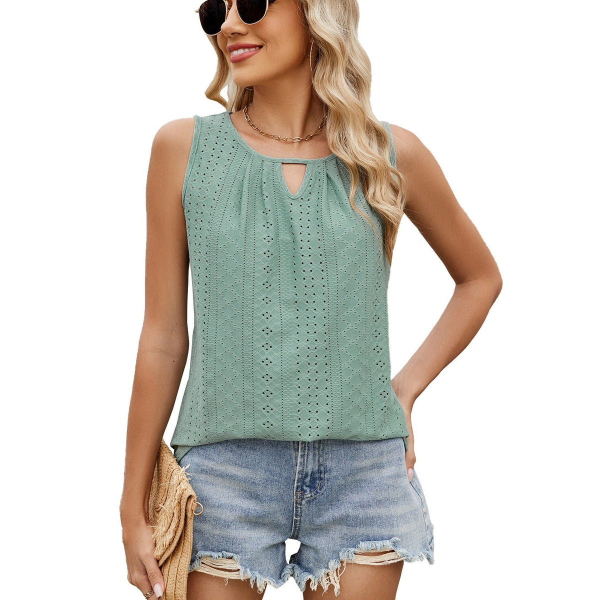 Mint green sleeveless loose-fit top with keyhole neckline and dotted eyelet pattern