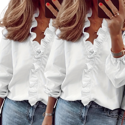 Two white ruffle V-neck blouses with long sleeves; gathered ruffle trim and cuffs