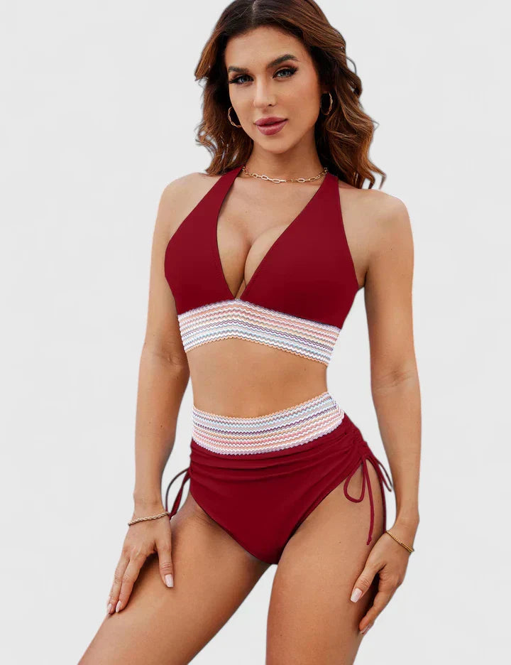 Women’s red bikini set with deep V top, striped waist band, and tie-side bottoms