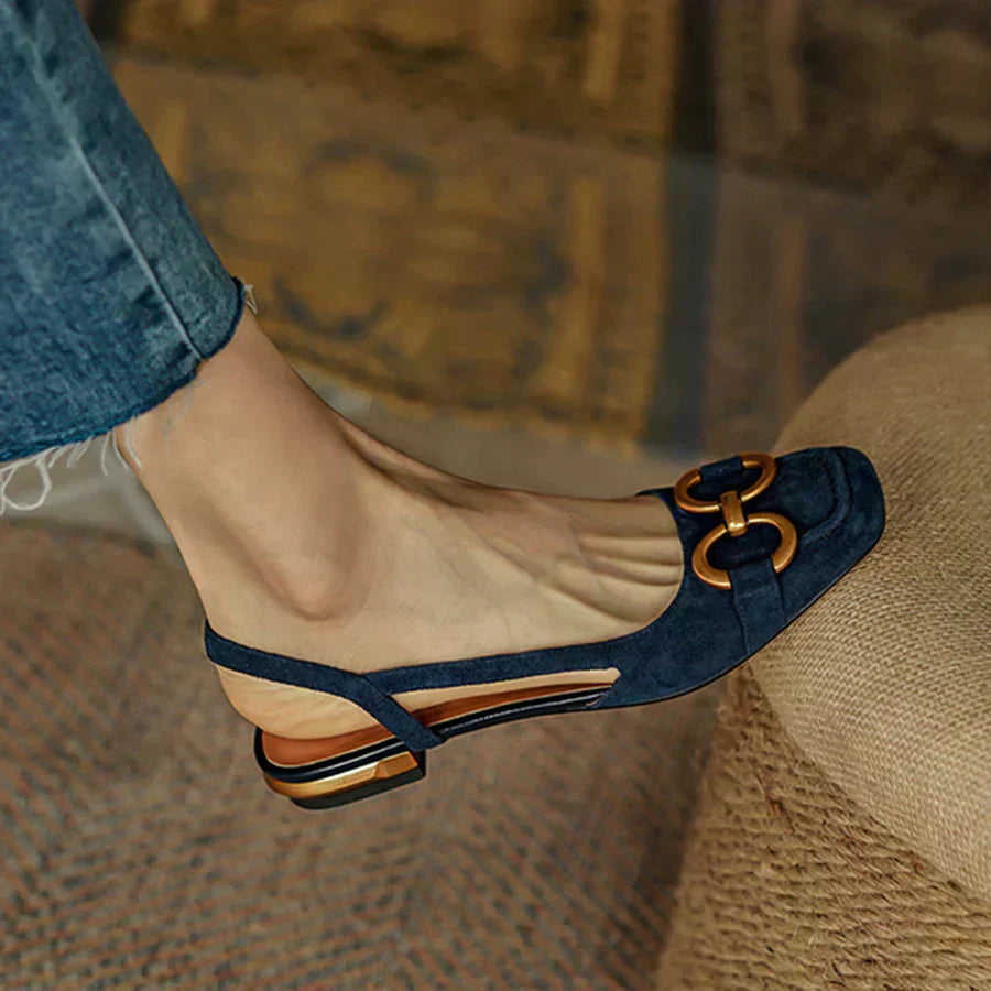 Dark blue orthopedic sandals, side view, gold-tone hardware accent on upper