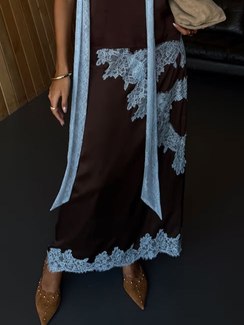 Dark brown lace dress with light blue lace wrap and scalloped floral hem