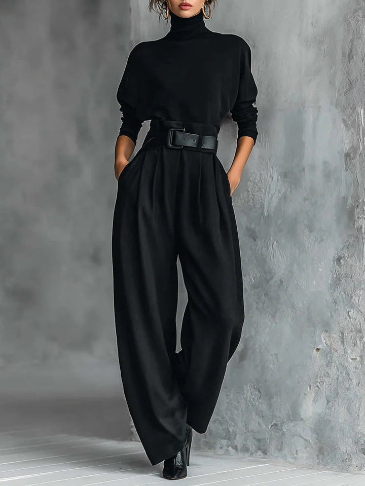Black fitted turtleneck top and straight-leg trousers set with wide belt