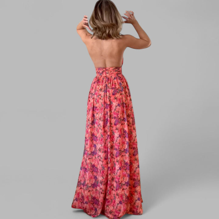 Floral maxi dress back view with halter-style top, gathered waist, and flowing skirt