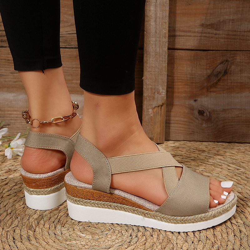 Beige canvas espadrille platform sandals with wide cross straps and ankle strap