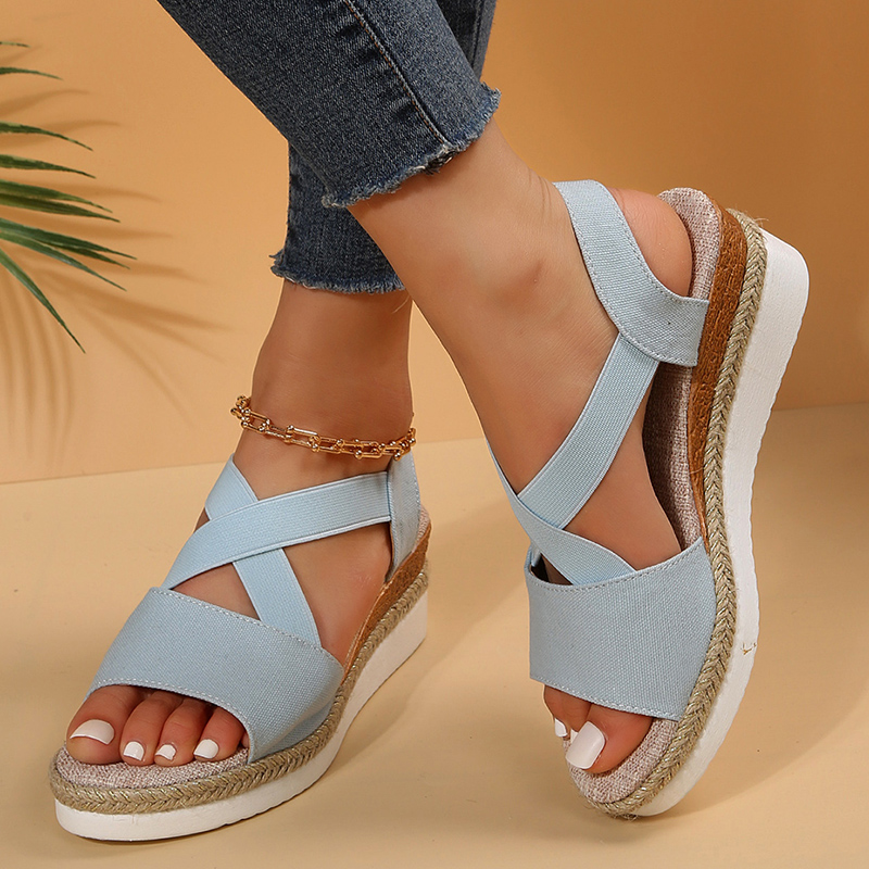 Light blue canvas espadrille platform sandals with wide ankle strap and toe straps