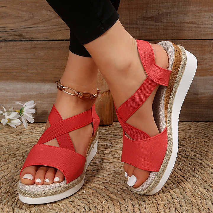 Red canvas espadrille platform sandals with crisscross toe straps and ankle strap