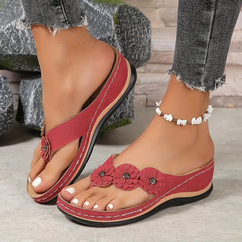 Red orthopedic sandals with three-flower front strap and cushioned sole