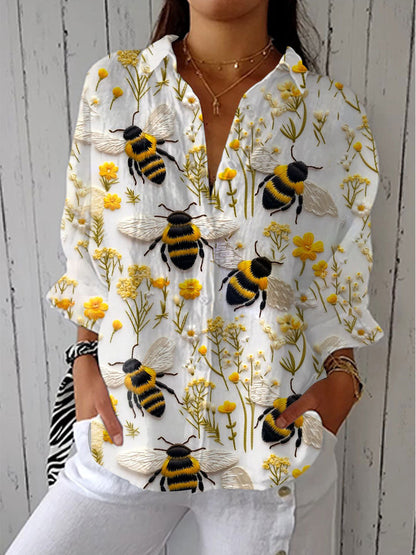 Embroidered bee blouse with yellow wildflower print, long sleeves, V-neck