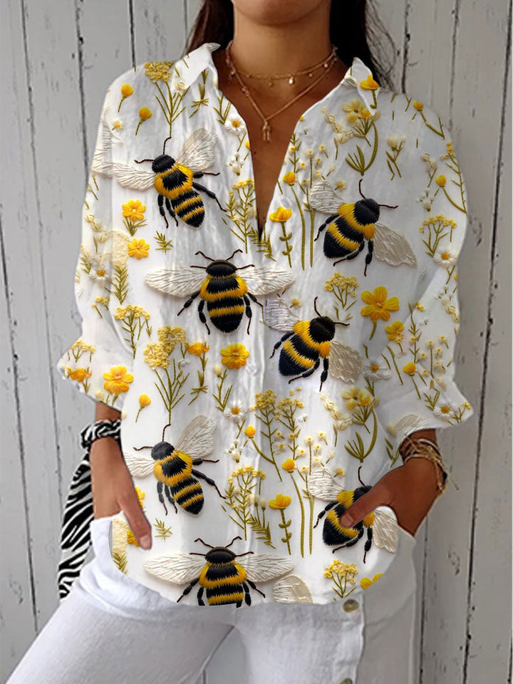 Embroidered bee blouse with yellow wildflower print, long sleeves, V-neck