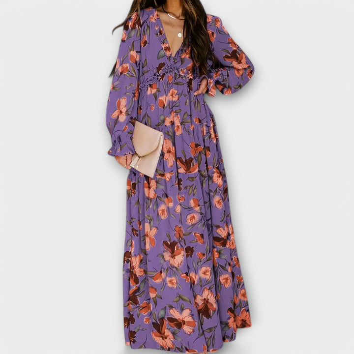 Floral maxi dress in purple with V-neck, long sleeves, gathered waist and tiered skirt