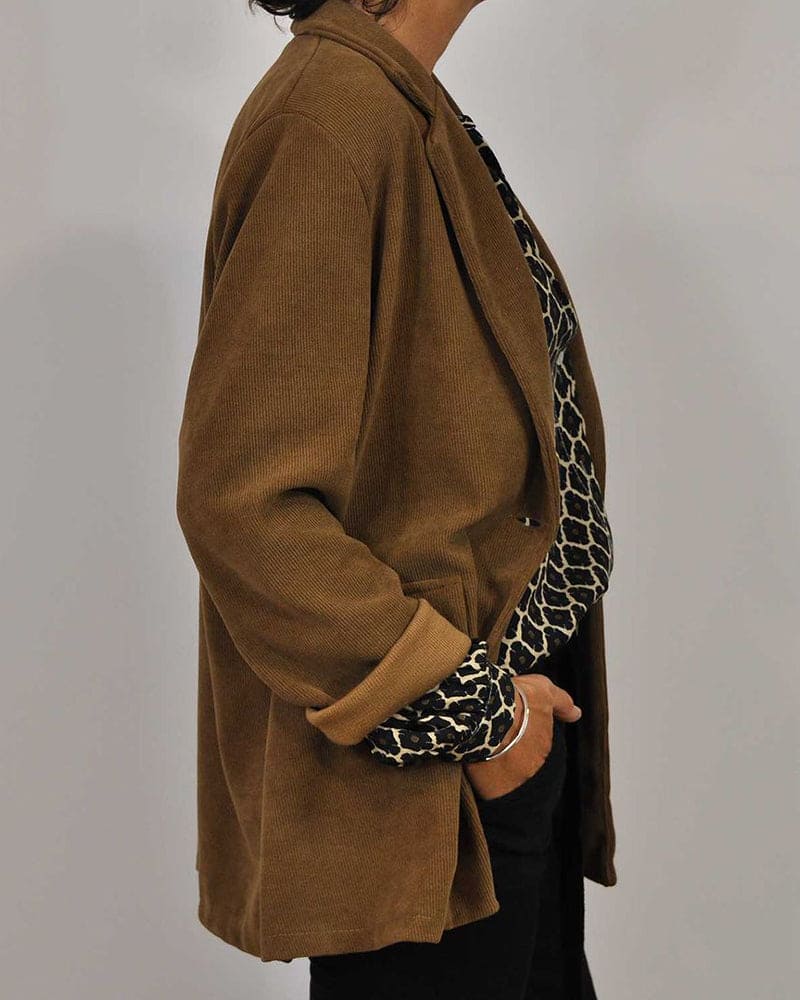 Geometric V-neck blouse with long sleeves, black and yellow lattice print, side view