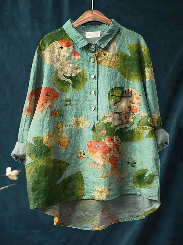 Teal long-sleeve button-up shirt with fish and seaweed graphic print