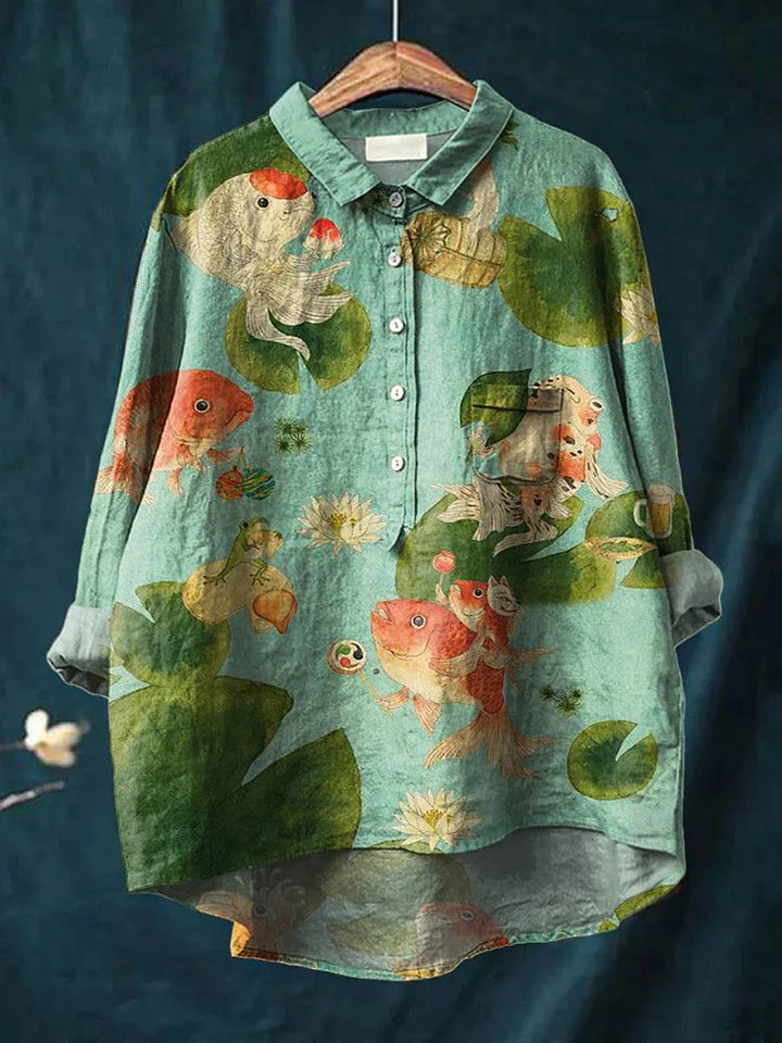 Teal long-sleeve button-up shirt with fish and seaweed graphic print
