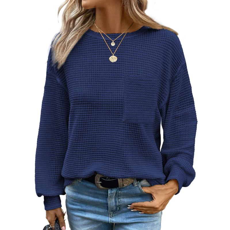 Navy blue oversized long-sleeve crewneck blouse with waffle knit texture and chest pocket