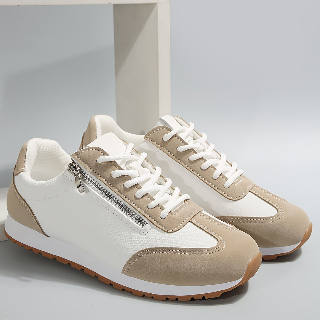 Casual low-top sneakers, white with beige panels, lace-up and zip detail.