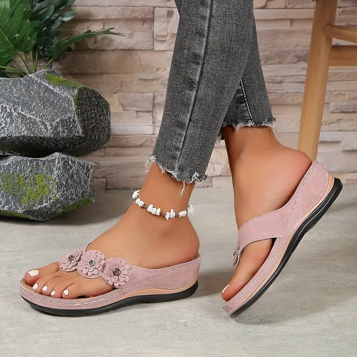 Light pink orthopedic sandals with floral front strap and cushioned sole