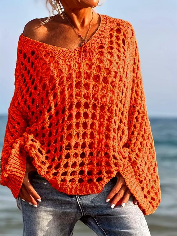 Comfy long-sleeve knit top in orange-red with openwork pattern and fringe trim