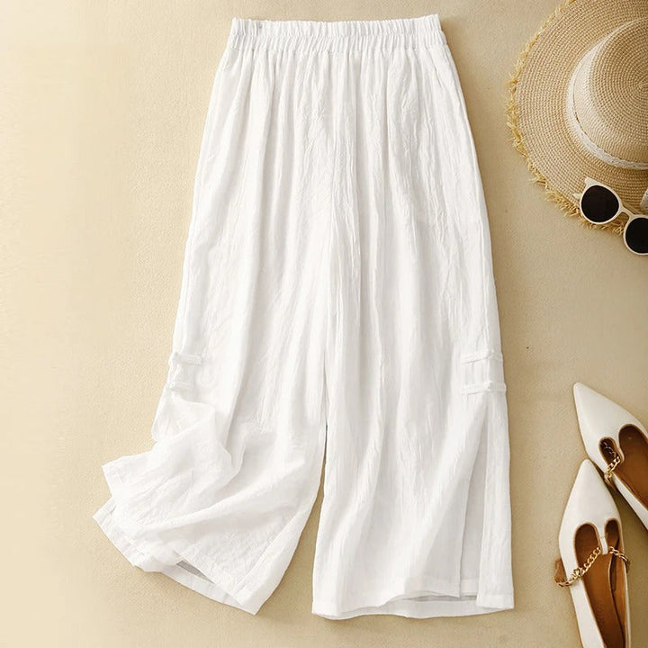White linen casual pants with elastic waistband and wide cropped legs
