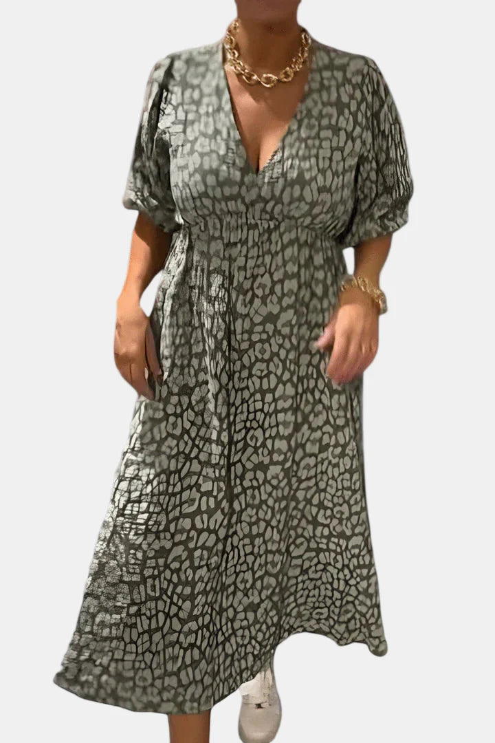 Olive green and black patterned V-neck dress with short puff sleeves and elastic waist