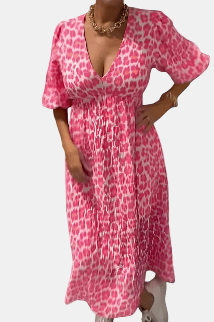 Pink leopard-print dress with deep V-neck, puff sleeves, and ruched waist