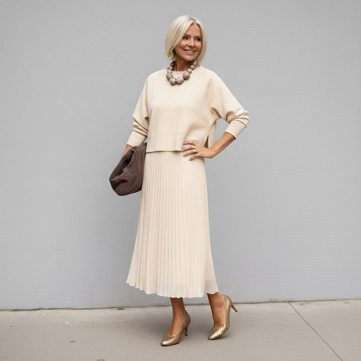 Ivory knit layered dress set with elbow sleeves and pleated tulle midi skirt