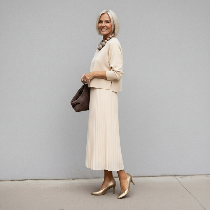 Ivory knit layered dress set side view with pleated tulle midi skirt