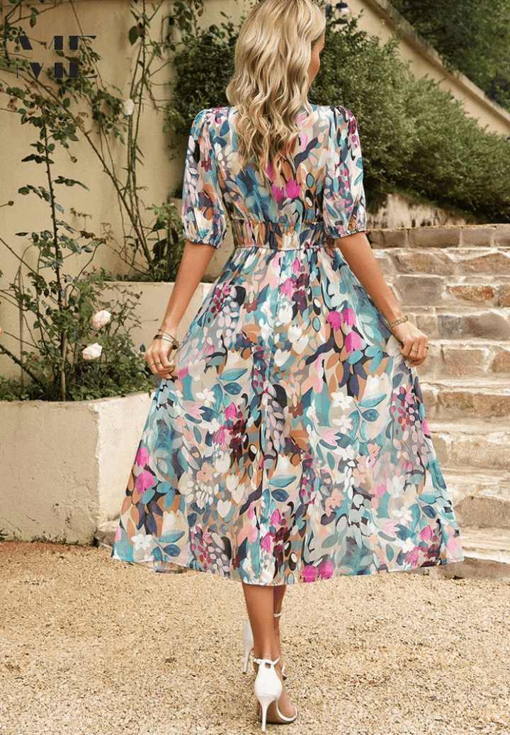 Floral midi dress, V-neck style with puff sleeves and gathered waist, seen from back