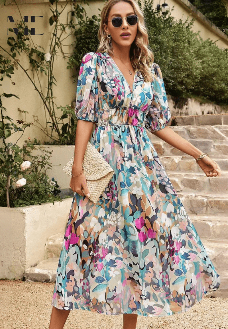 Floral midi dress with V-neck and puff sleeves, gathered waist, holding a woven clutch