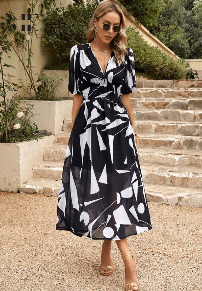 Lorenza midi dress in black with white abstract print, cinched waist, midi skirt
