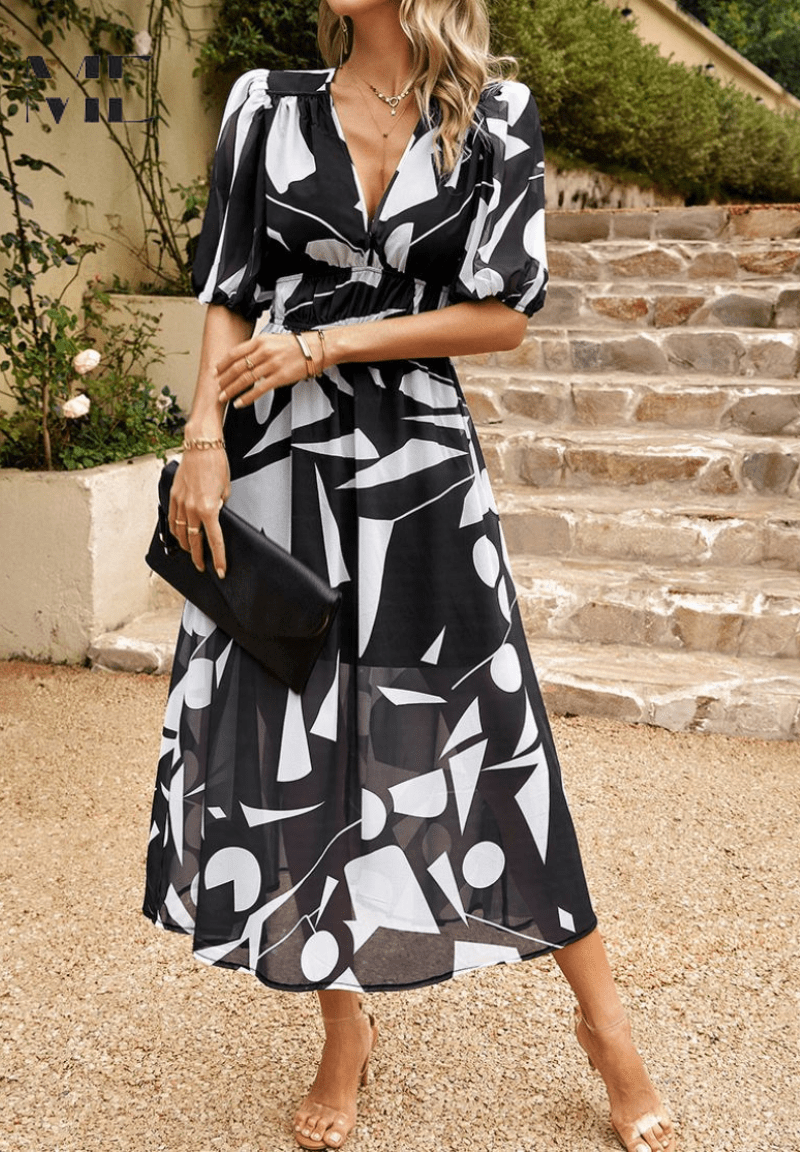 Lorenza midi dress in black with white abstract print, gathered waist, puff sleeves
