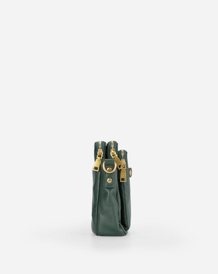 Jovie deep green crossbody bag, side view with stacked handles and adjustable shoulder strap