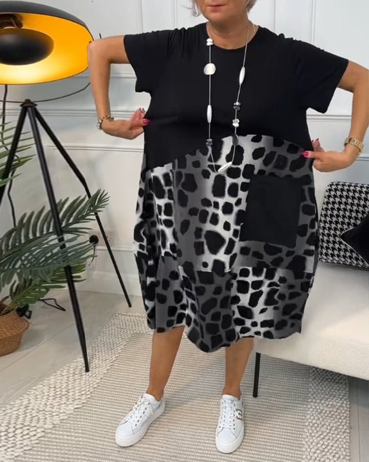 Women's black midi dress with leopard print panels, short sleeves, loose fit