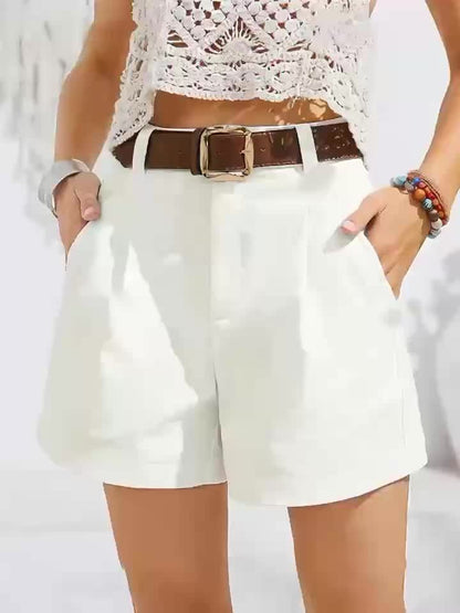 White high-waist shorts with dark brown belt and gold-tone buckle