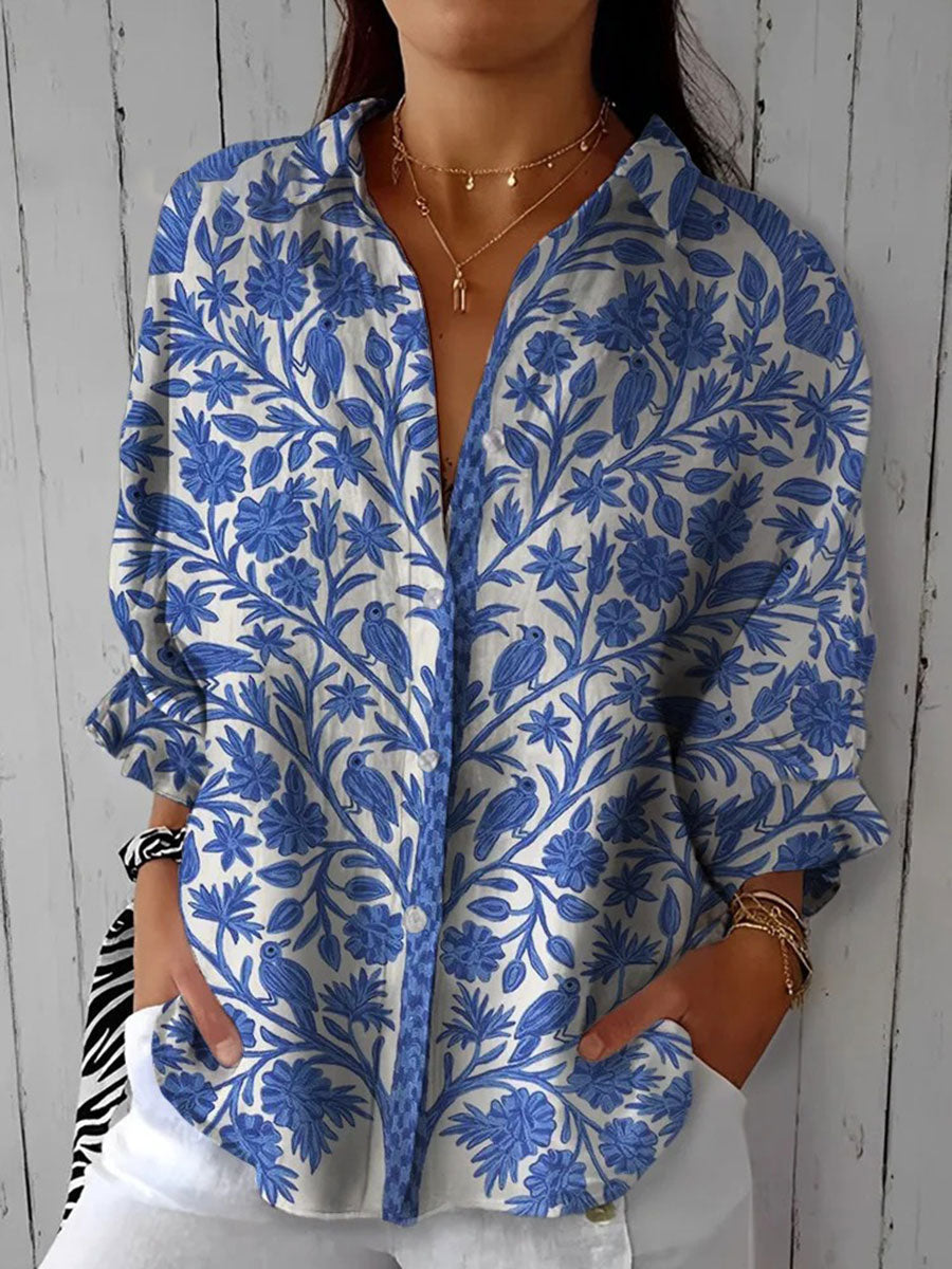 Blue garden-print blouse with button front, open collar, long sleeves
