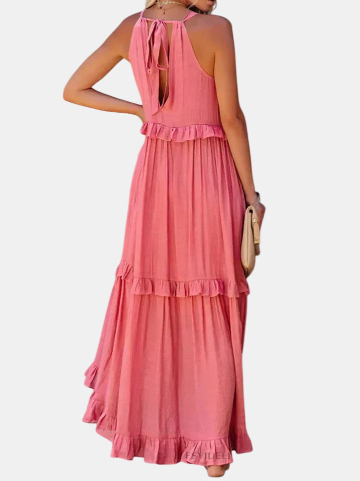 Pink sleeveless long dress with open back halter tie and layered tiered skirt