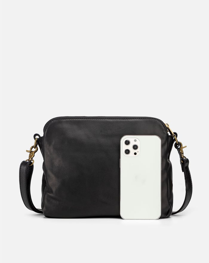 Jovie sleek three-layer crossbody bag in dark black with front zip pocket and adjustable strap